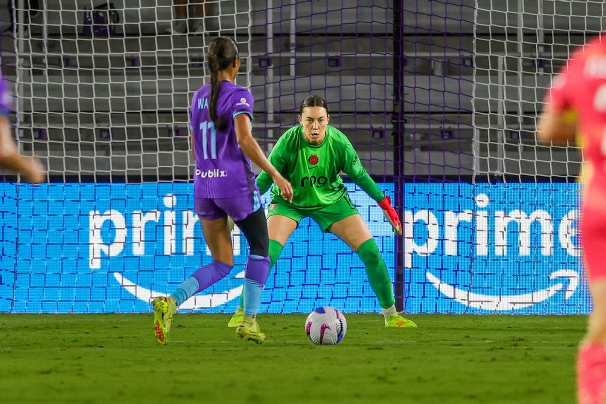 Oct 10, 2025; Orlando, Florida, USA; Orlando Pride forward Ally Watt (11) takes a shot on goal against Portland Thorns FC goalkeeper MacKenzie Arnold (18) during the first half at Inter&Co Stadium. Mandatory Credit: Mike Watters-Imagn Images