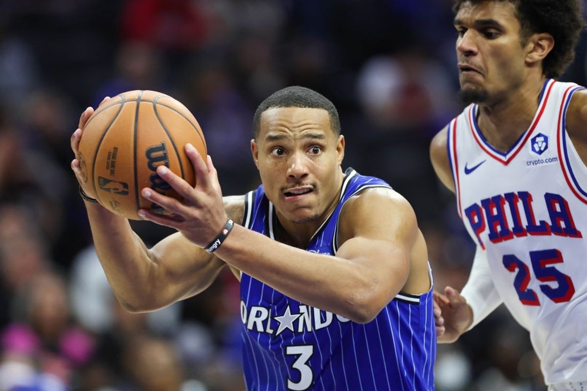 Oct 10, 2025; Philadelphia, Pennsylvania, USA; Orlando Magic guard Desmond Bane (3) drives past Philadelphia 76ers forward Dominick Barlow (25) during the third quarter at Xfinity Mobile Arena. Mandatory Credit: Bill Streicher-Imagn Images