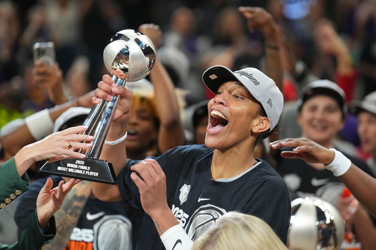 Oct 10, 2025; Phoenix, Arizona, USA; Las Vegas Aces center A'ja Wilson (22) celebrates with teammates after Game 4 of the 2025 WNBA Finals at Mortgage Matchup Center. Mandatory Credit: Joe Camporeale-Imagn Images