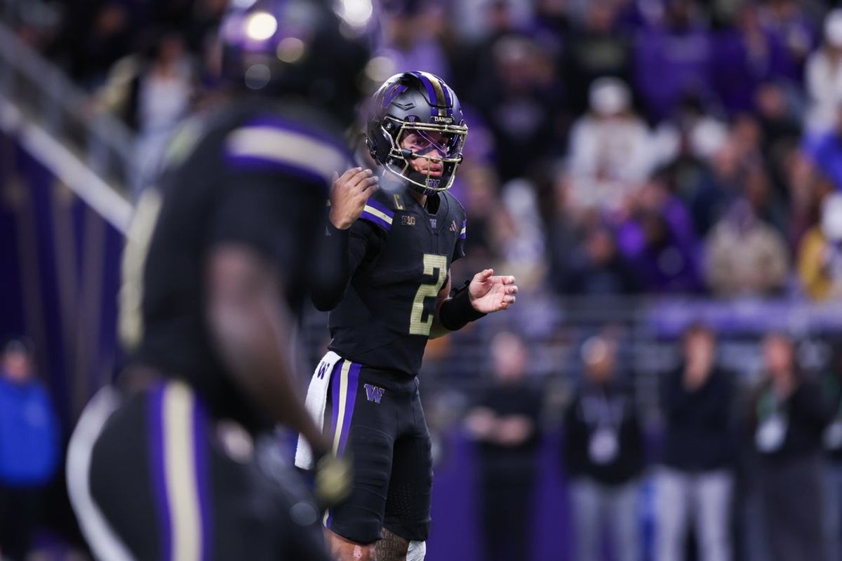 Oct 10, 2025; Seattle, Washington, USA; Washington Huskies quarterback Demond Williams Jr. (2) waves over running back Jonah Coleman (1) before a play against the Rutgers Scarlet Knights  at Husky Stadium. Mandatory Credit: Kevin Ng-Imagn Images