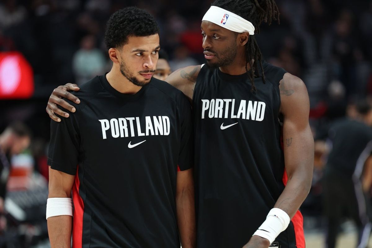 Oct 10, 2025; Portland, Oregon, USA;  Portland Trail Blazers forward Toumani Camara (33) and guard Shaedon Sharpe (17) share a moment before playing in a game against Sacramento Kings at Moda Center. Mandatory Credit: Jaime Valdez-Imagn Images