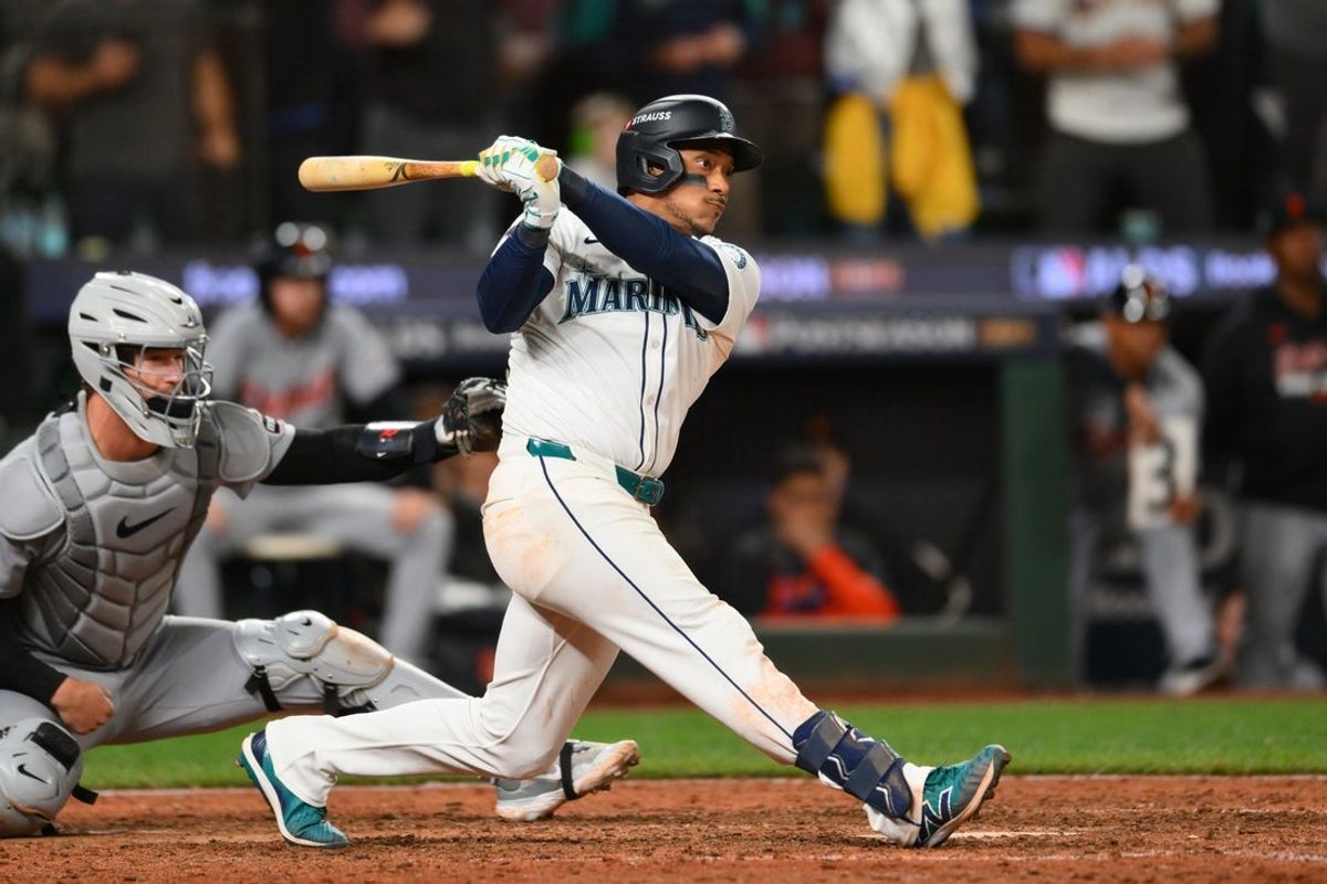 Oct 10, 2025; Seattle, Washington, USA; Seattle Mariners second baseman Jorge Polanco (7) hits a walk off single against the Detroit Tigers during the fifteenth inning during game five of the ALDS round for the 2025 MLB playoffs at T-Mobile Park. Mandatory Credit: Steven Bisig-Imagn Images