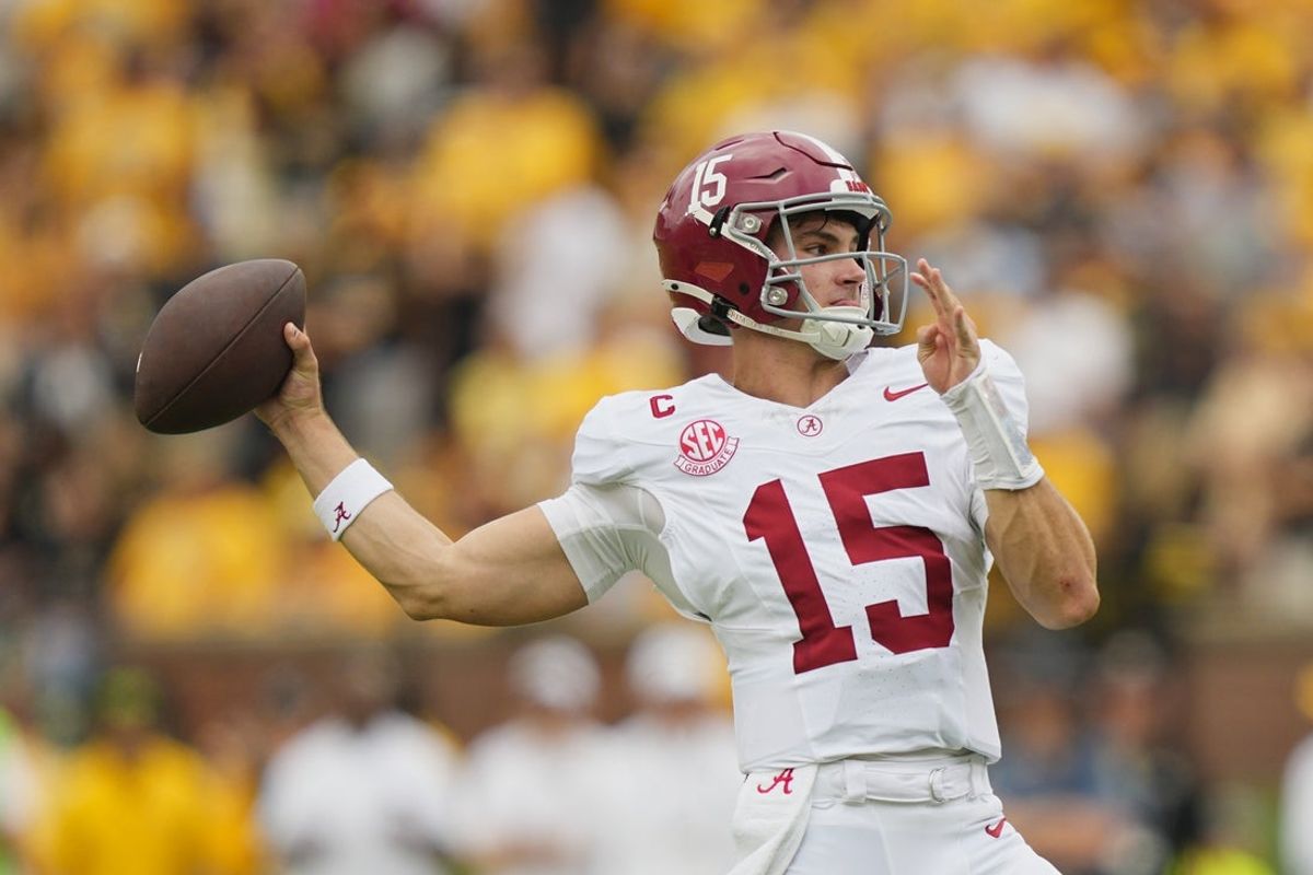 Oct 11, 2025; Columbia, Missouri, USA; Alabama Crimson Tide quarterback Ty Simpson (15) throws against the Missouri Tigers during the first half of the game at Faurot Field at Memorial Stadium. Mandatory Credit: Jay Biggerstaff-Imagn Images