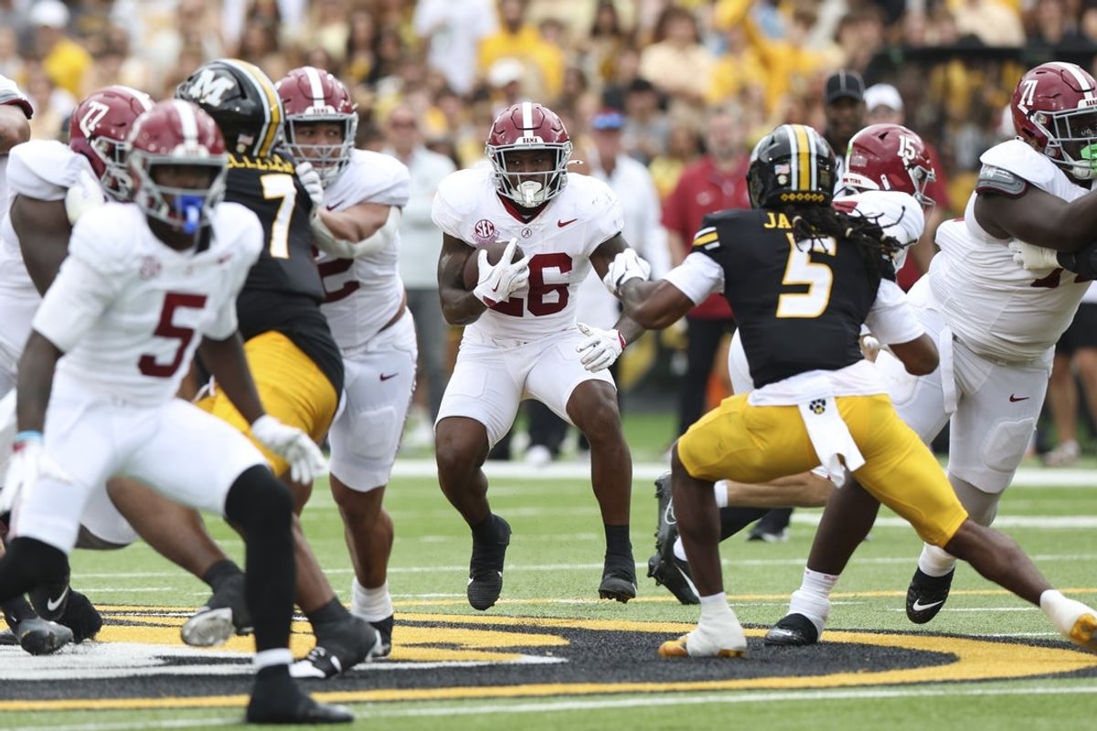 Oct 11, 2025; Columbia, Missouri, USA;  Alabama Crimson Tide running back Jamarion Miller (26) runs the ball against the Missouri Tigers during the first half at Faurot Field at Memorial Stadium. Mandatory Credit: Reese Strickland-Imagn Images