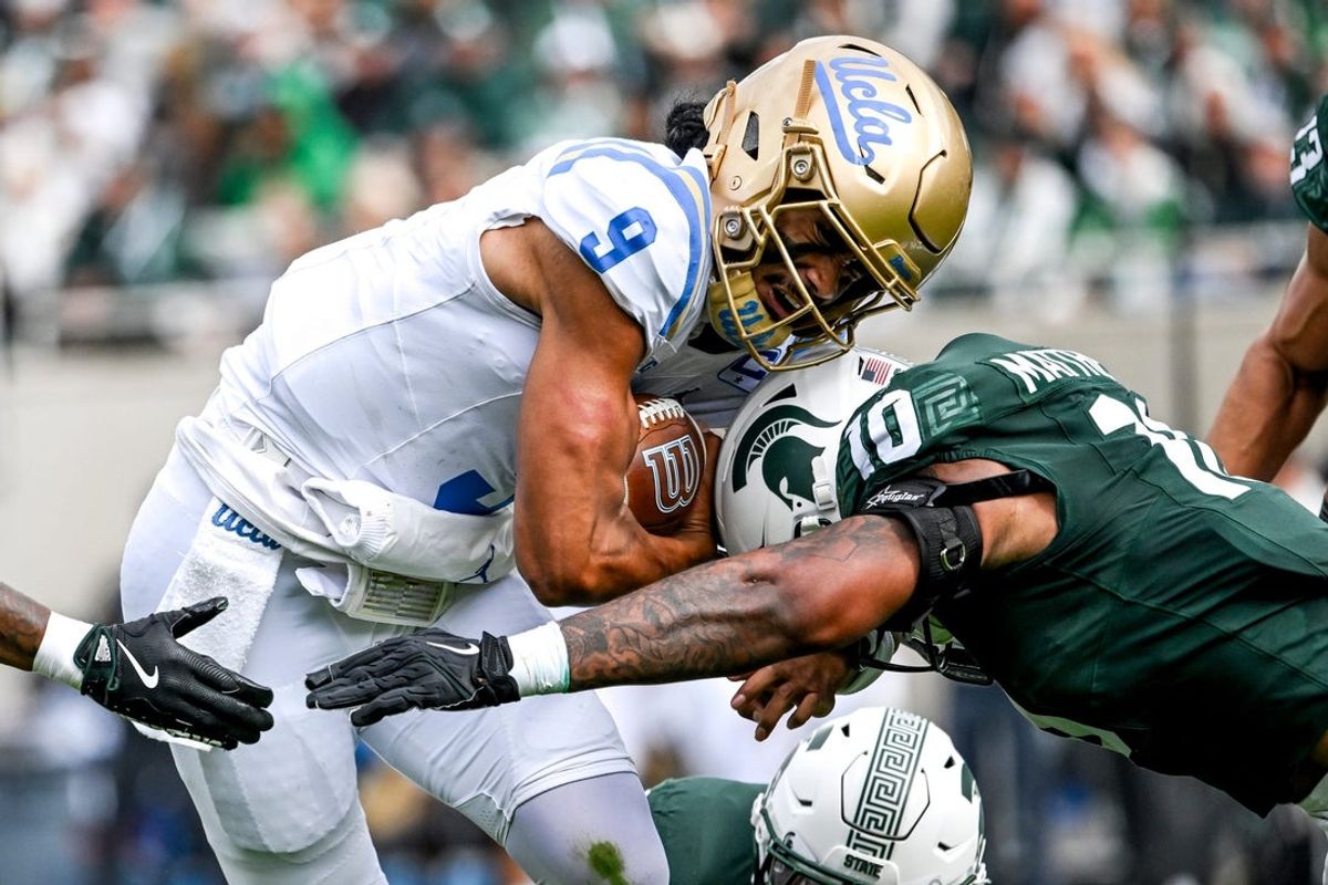 Michigan State's Wayne Matthews III, right, tackles UCLA's Nico Iamaleava during the second quarter on Saturday, Oct. 11, 2025, at Spartan Stadium in East Lansing.