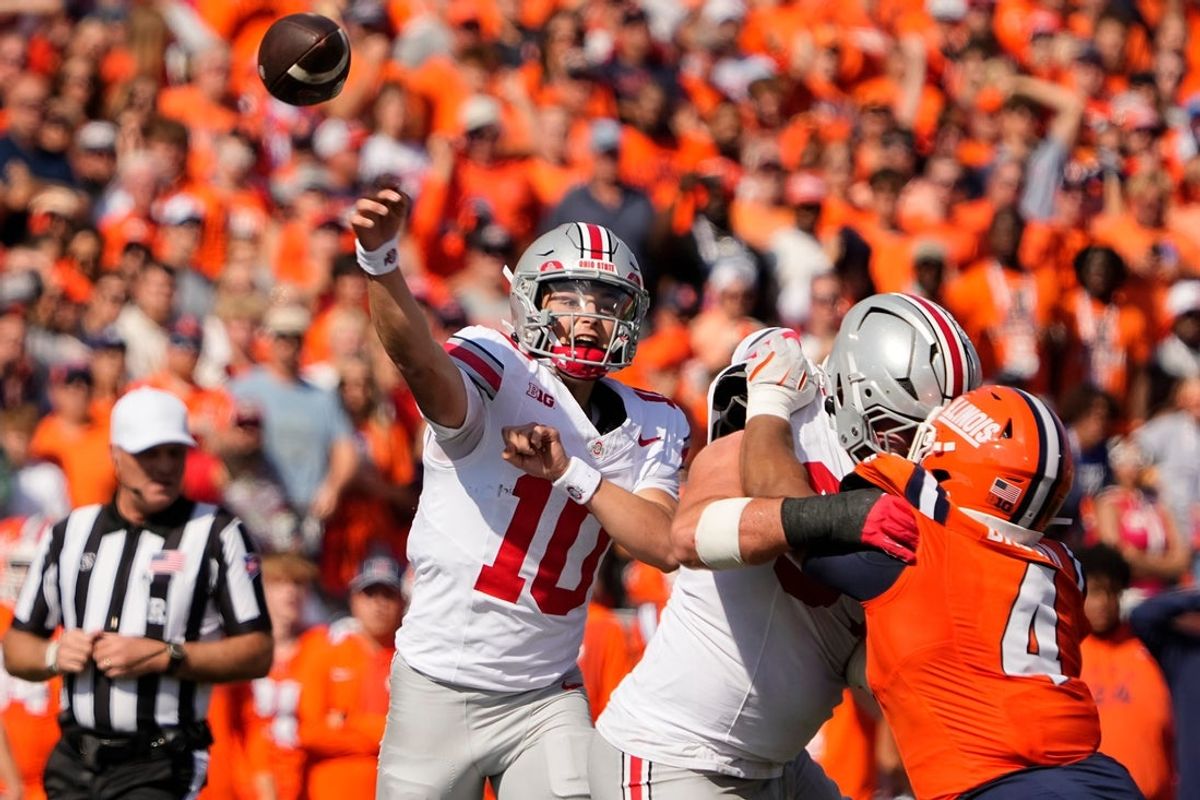 Ohio State Buckeyes quarterback Julian Sayin (10) throws during the first half of the NCAA football game against the Illinois Fighting Illini at Gies Memorial Stadium in Champaign on Oct. 11, 2025.