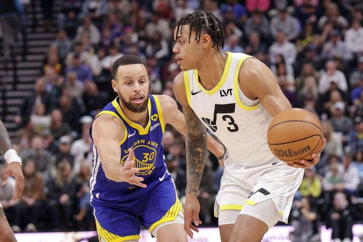 Feb 15, 2024; Salt Lake City, Utah, USA; Utah Jazz guard Keyonte George (3) keeps the ball away from Golden State Warriors guard Stephen Curry (30) during the first quarter at Delta Center.