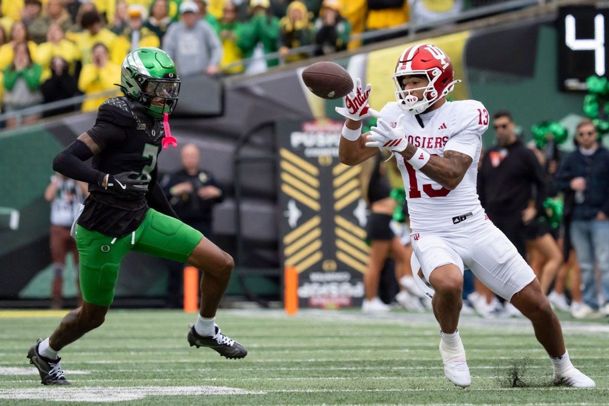 Indiana wide receiver Elijah Sarratt hauls in a pass under cover from Oregon defensive back Sione Laulea as the Oregon Ducks host the Indiana Hoosiers Oct. 11, 2025, at Autzen Stadium in Eugene, Oregon.