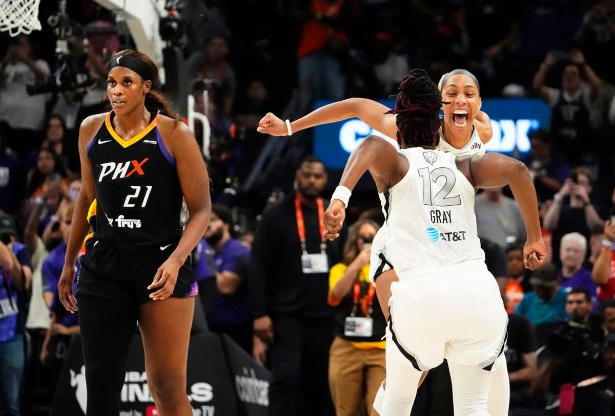 Las Vegas Aces guard Chelsea Gray (12) and center A'ja Wilson (22) celebrate after defeating the Phoenix Mercury 97-86 to win the WNBA Championship in a four-game sweep at Mortgage Matchup Center on Oct. 10, 2025, in Phoenix.