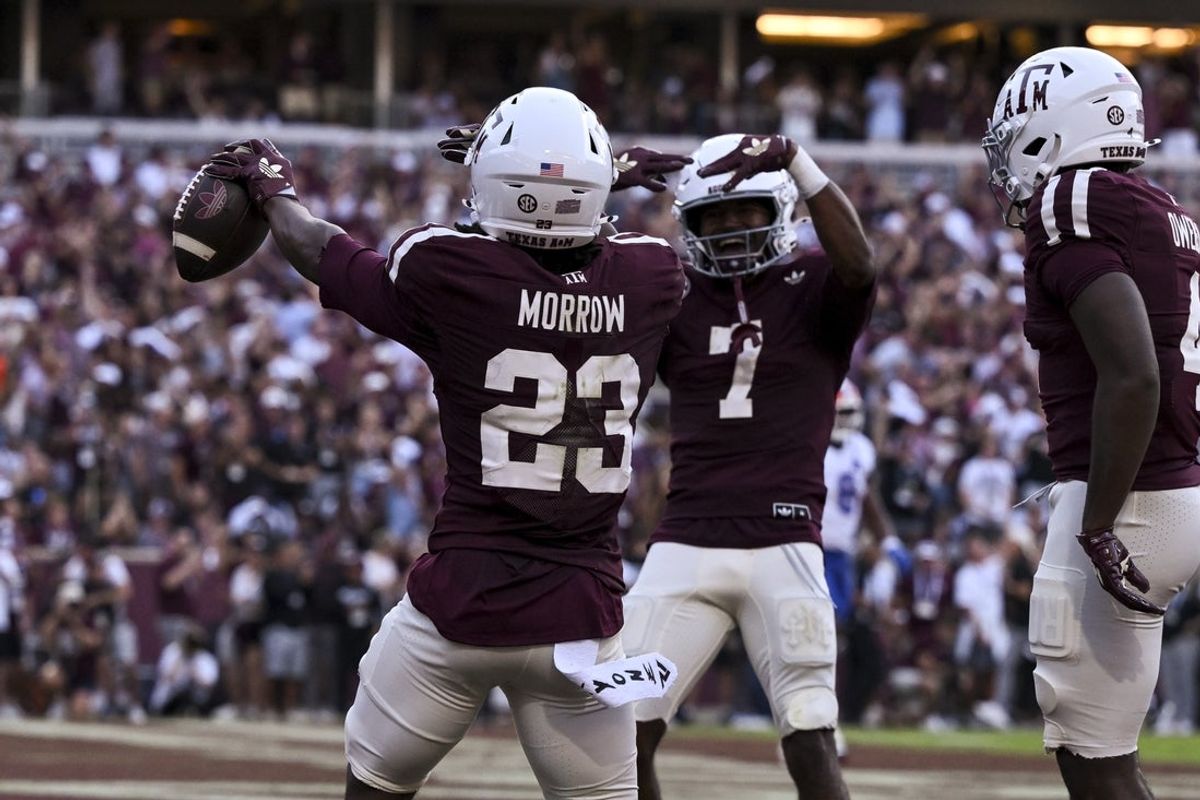Oct 11, 2025; College Station, Texas, USA;  Texas A&M Aggies running back Jamarion Morrow (23) celebrates after scoring a touchdown during the first quarter against the Florida Gators at Kyle Field. Mandatory Credit: Maria Lysaker-Imagn Images