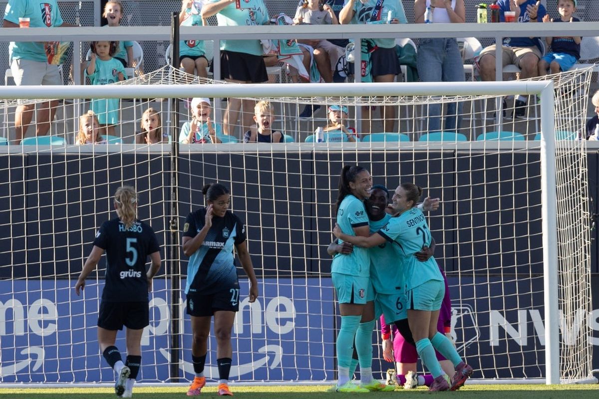 Oct 11, 2025; Kansas City, Missouri, USA; Kansas City Current teammates Bia Zaneratto (left), Temwa Chawinga (center) and Ally Sentor celebrate a goal by Chawinga in the second half of the match against Gotham FC at CPKC Stadium. Mandatory Credit: Kylie Graham-Imagn Images