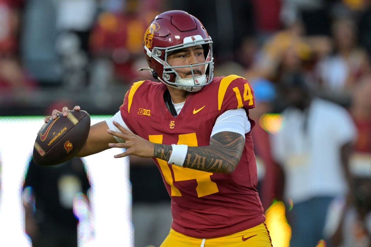 Oct 11, 2025; Los Angeles, California, USA;  USC Trojans quarterback Jayden Maiava (14) throws a pass in the first half against the Michigan Wolverines at United Airlines Field at the Los Angeles Memorial Coliseum. Mandatory Credit: Jayne Kamin-Oncea-Imagn Images