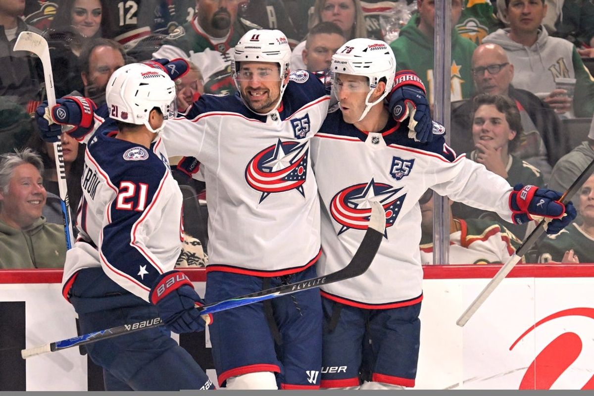Oct 11, 2025; Saint Paul, Minnesota, USA;  Columbus Blue Jackets forward Miles Wood (11) celebrates his goal against the Minnesota Wild with forward Isac Lundestrom (21) and defensemen Damon Severson (78) during the first period at Grand Casino Arena. Mandatory Credit: Nick Wosika-Imagn Images