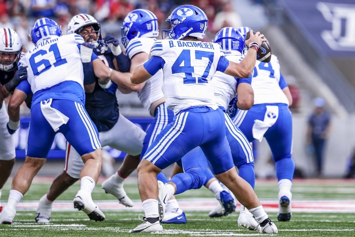 Oct 11, 2025; Tucson, Arizona, USA; Brigham Young Cougars quarterback Bear Bachmeier (47) passes the ball during the first quarter of the game against the Arizona Wildcats at Arizona Stadium. Mandatory Credit: Aryanna Frank-Imagn Images