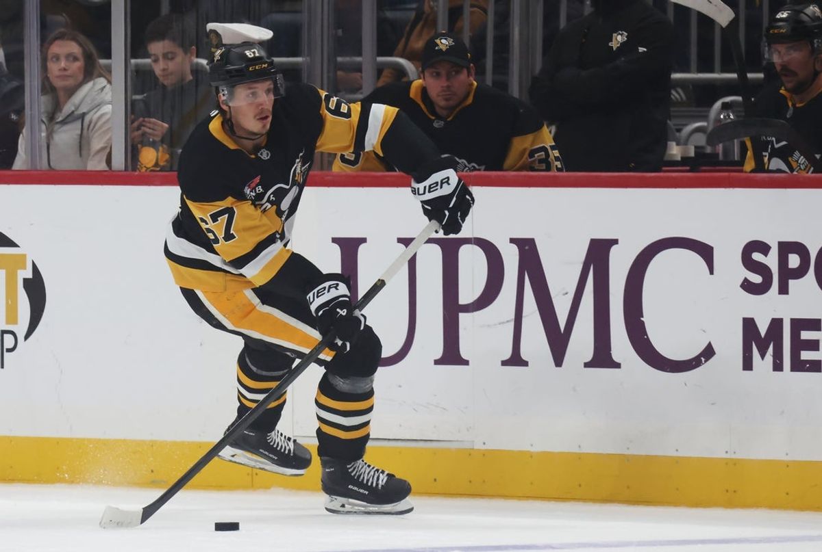 Oct 11, 2025; Pittsburgh, Pennsylvania, USA;  Pittsburgh Penguins right wing Rickard Rakell (67) skates with the puck against the New York Rangers during the third period at PPG Paints Arena. Mandatory Credit: Charles LeClaire-Imagn Images