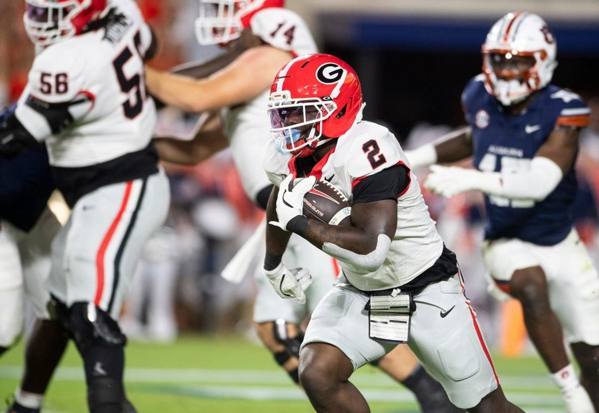 Georgia Bulldogs running back Josh McCray (2) runs the ball as Auburn Tigers take on Georgia Bulldogs at Jordan-Hare Stadium in Auburn, Ala. on Saturday, Oct. 11, 2025. Auburn Tigers lead Georgia Bulldogs 10-3 at halftime.
