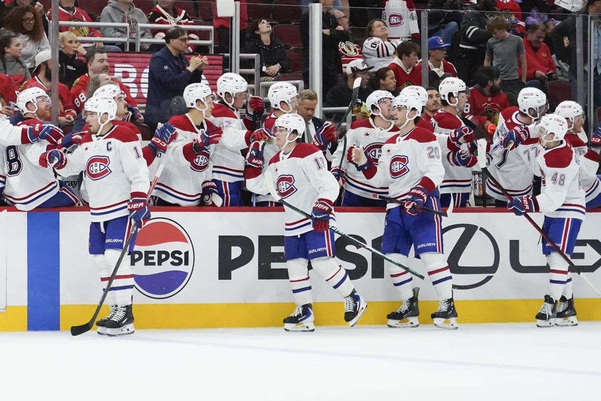 Oct 11, 2025; Chicago, Illinois, USA; The Montréal Canadiens celebrate the game winning goal against the Chicago Blackhawks during the third period at United Center. Mandatory Credit: David Banks-Imagn Images