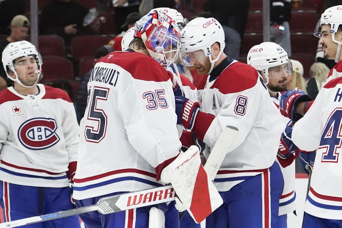 Oct 11, 2025; Chicago, Illinois, USA; Montréal Canadiens goaltender Sam Montembeault (35) and  defenseman Mike Matheson (8) celebrate their win against the Chicago Blackhawks at United Center. Mandatory Credit: David Banks-Imagn Images