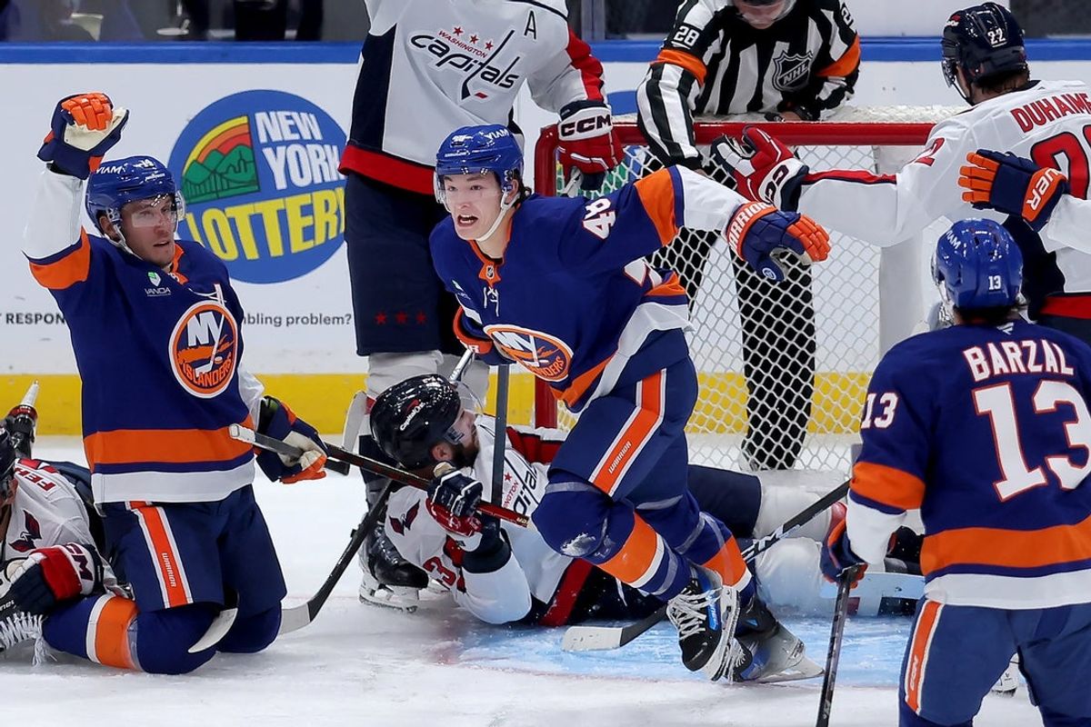 Oct 11, 2025; Elmont, New York, USA; New York Islanders defenseman Matthew Schaefer (48) celebrates his goal against the Washington Capitals during the third period at UBS Arena. The goal was the first of his NHL career. Mandatory Credit: Brad Penner-Imagn Images