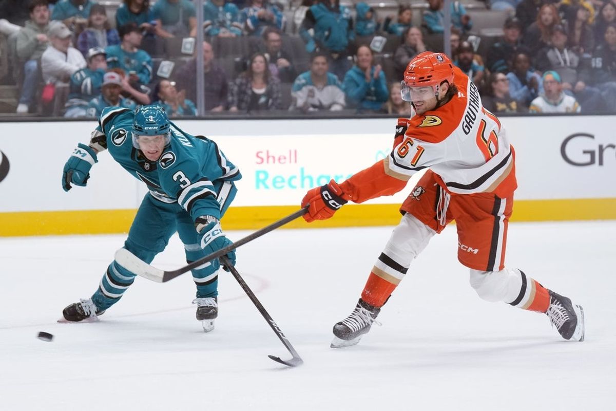 Oct 11, 2025; San Jose, California, USA; Anaheim Ducks left wing Cutter Gauthier (61) shoots against San Jose Sharks defenseman John Klingberg (3) and scores during the first period at SAP Center at San Jose. Mandatory Credit: Darren Yamashita-Imagn Images