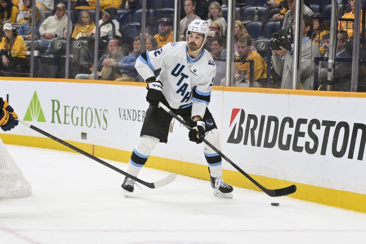 Oct 11, 2025; Nashville, Tennessee, USA;  Utah Mammoth center Jack McBain (22) skates behind the net against the Nashville Predators during the overtime period at Bridgestone Arena. Mandatory Credit: Steve Roberts-Imagn Images