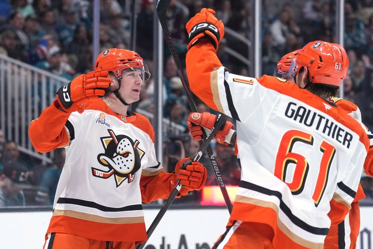 Oct 11, 2025; San Jose, California, USA; Anaheim Ducks right wing Beckett Sennecke (left) celebrates with left wing Cutter Gauthier (61) after scoring a goal against the San Jose Sharks during the first period at SAP Center at San Jose. Mandatory Credit: Darren Yamashita-Imagn Images