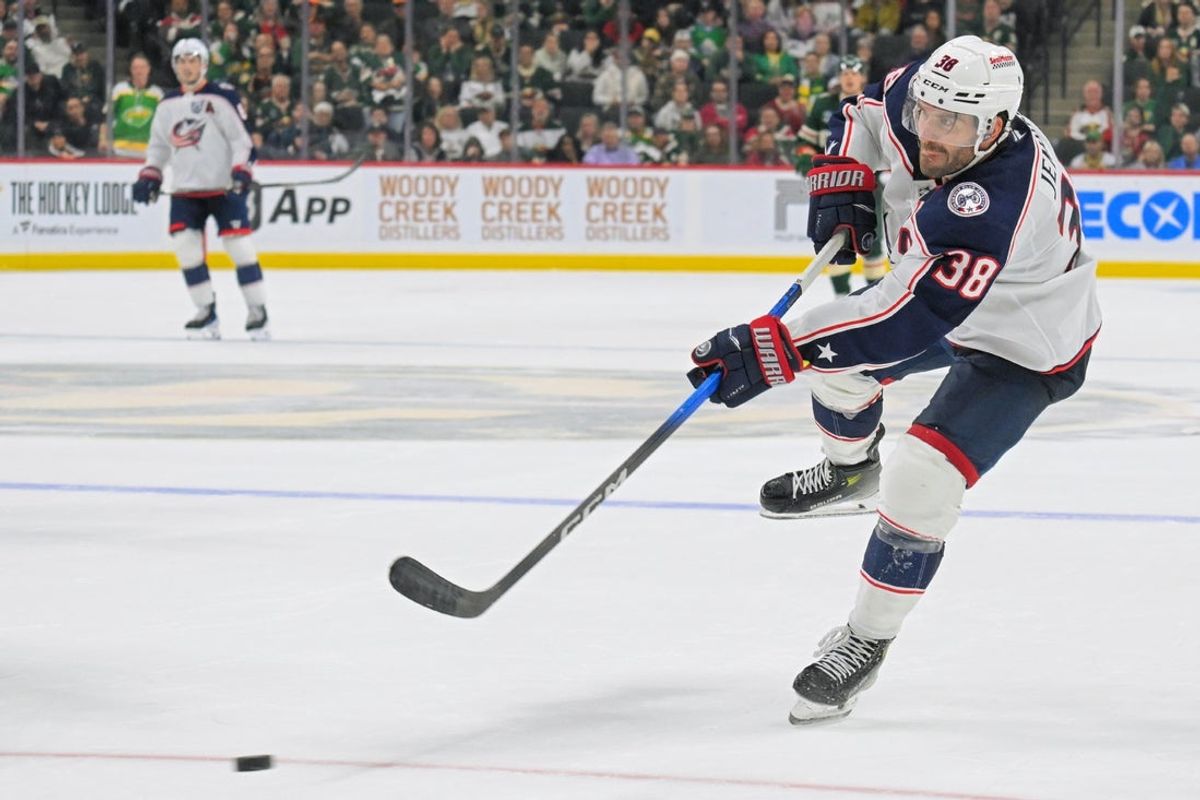 Oct 11, 2025; Saint Paul, Minnesota, USA;  Columbus Blue Jackets forward Boone Jenner (38) scores an empty net goal against the Minnesota Wild during the third period at Grand Casino Arena. Mandatory Credit: Nick Wosika-Imagn Images