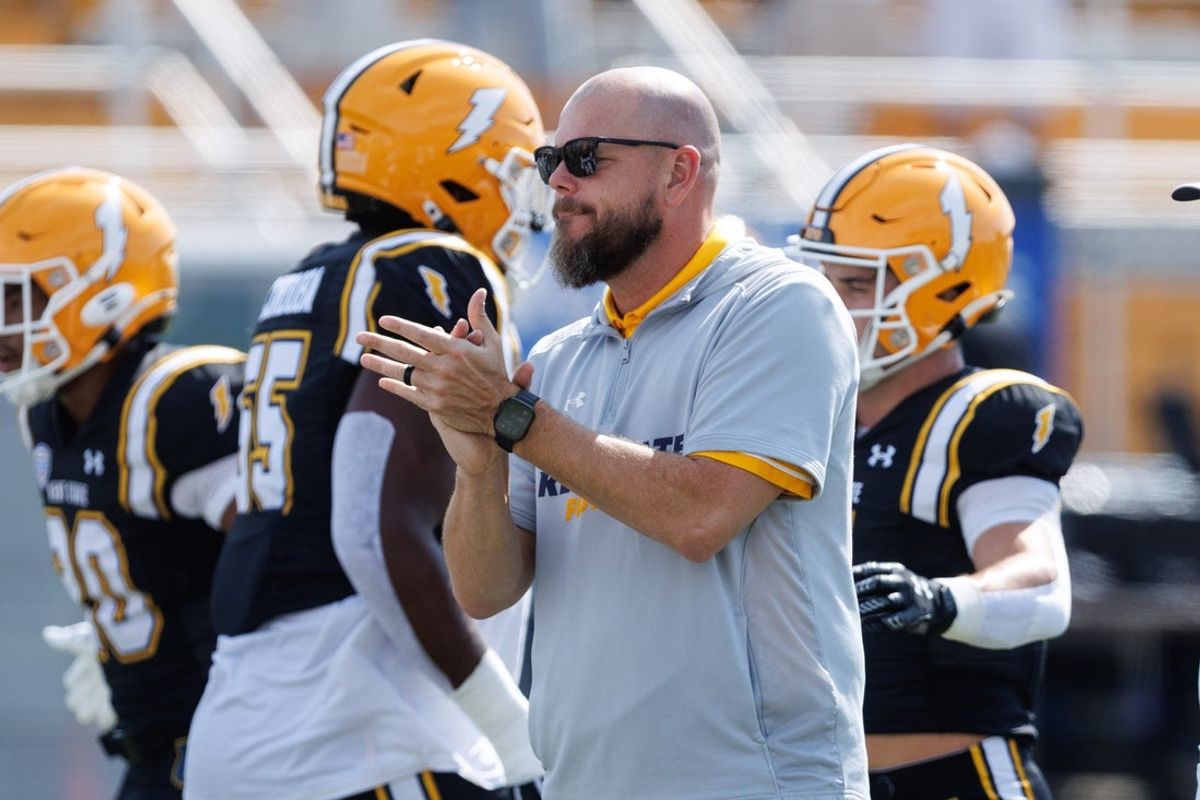 Kent State interim coach Mark Carney watches his team through warmups before a game against Buffalo on Sept. 13, 2025, in Kent.