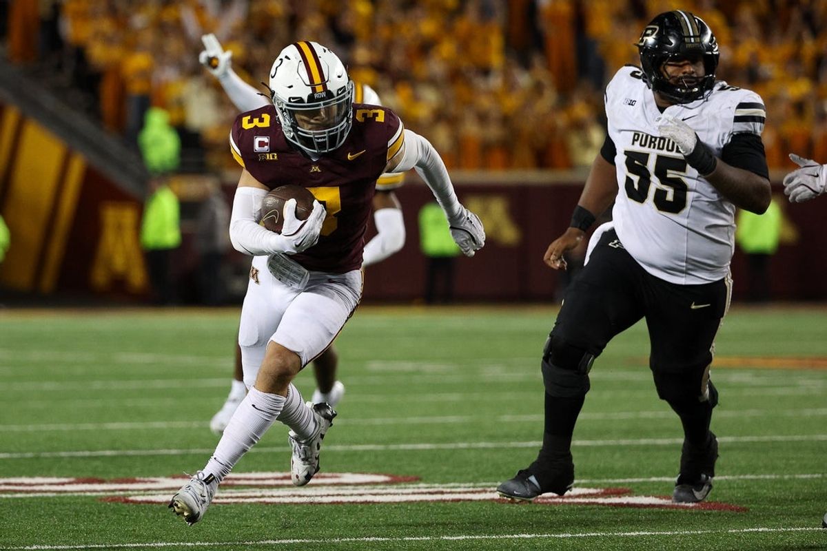 Oct 11, 2025; Minneapolis, Minnesota, USA; Minnesota Golden Gophers defensive back Koi Perich (3) intercepts a pass for a touchdown against the Purdue Boilermakers during the second half at Huntington Bank Stadium. Mandatory Credit: Matt Krohn-Imagn Images