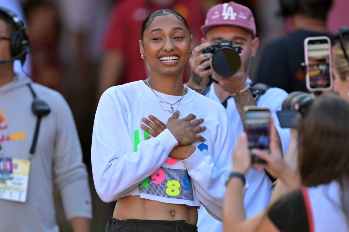 Oct 11, 2025; Los Angeles, California, USA; USC Trojans basketball player JuJu Watkins was on hand as she was named the tunnel captain the the game against the Michigan Wolverines at United Airlines Field at the Los Angeles Memorial Coliseum. Mandatory Credit: Jayne Kamin-Oncea-Imagn Images