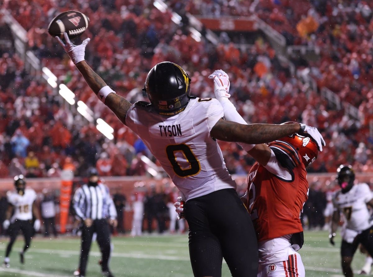 Oct 11, 2025; Salt Lake City, Utah, USA; Arizona State Sun Devils wide receiver Jordyn Tyson (0) and Utah Utes cornerback Smith Snowden (2) battle for a passed ball during the second quarter at Rice-Eccles Stadium. Mandatory Credit: Rob Gray-Imagn Images