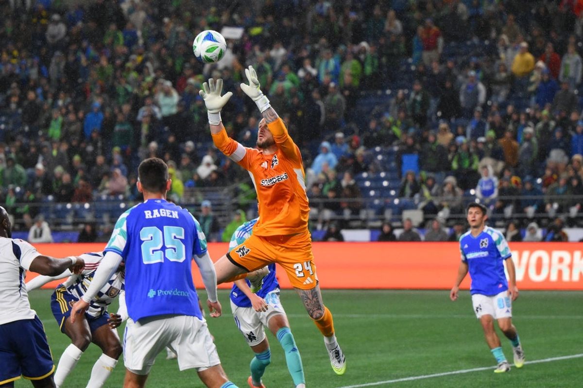 Oct 11, 2025; Seattle, Washington, USA; Seattle Sounders FC goalkeeper Stefan Frei (24) jumps for the ball during the second half against Real Salt Lake at Lumen Field. Mandatory Credit: Steven Bisig-Imagn Images