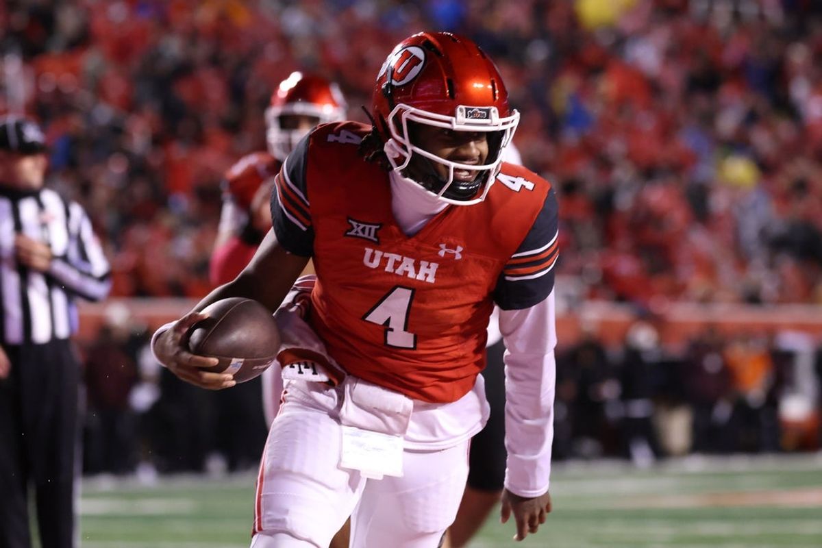 Oct 11, 2025; Salt Lake City, Utah, USA; Utah Utes quarterback Devon Dampier (4) scores a touchdown against the Arizona State Sun Devils during the third quarter at Rice-Eccles Stadium. Mandatory Credit: Rob Gray-Imagn Images