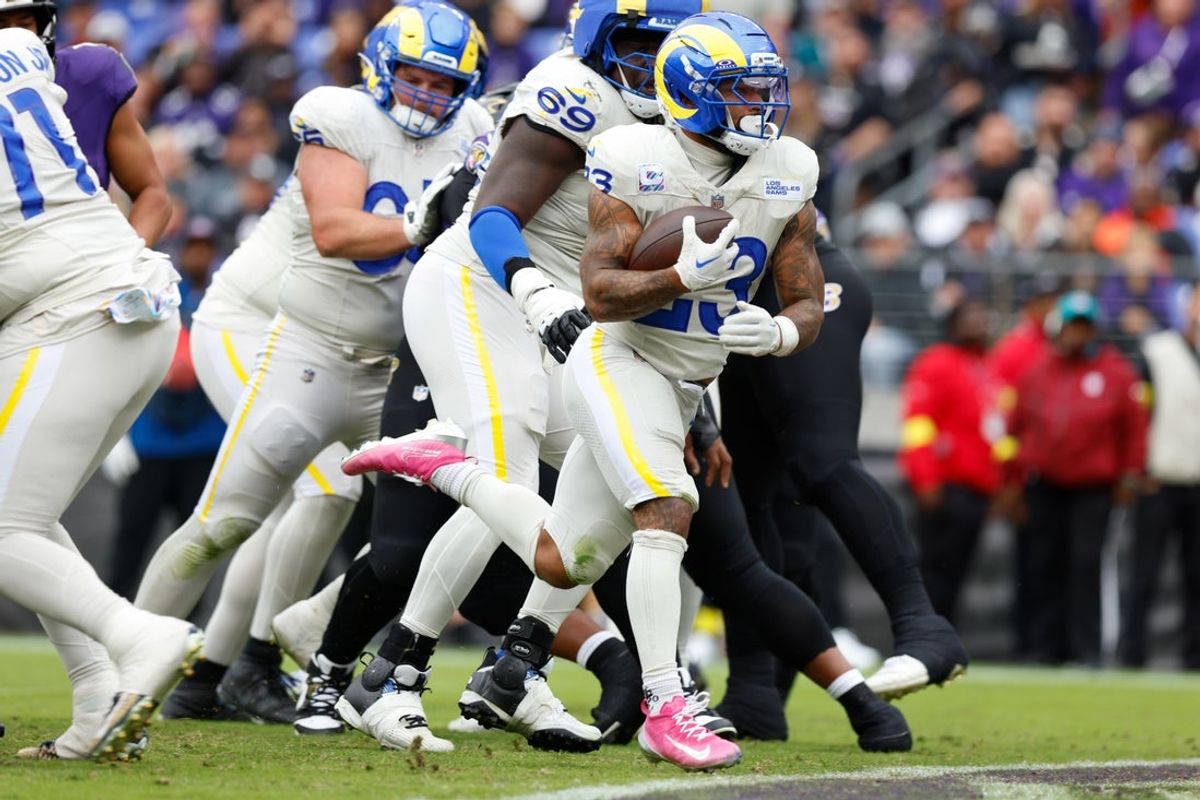 Oct 12, 2025; Baltimore, Maryland, USA; Los Angeles Rams running back Kyren Williams (23) carries the ball against the Baltimore Ravens for a touchdown during the third quarter of the game at M&T Bank Stadium. Mandatory Credit: Peter Casey-Imagn Images