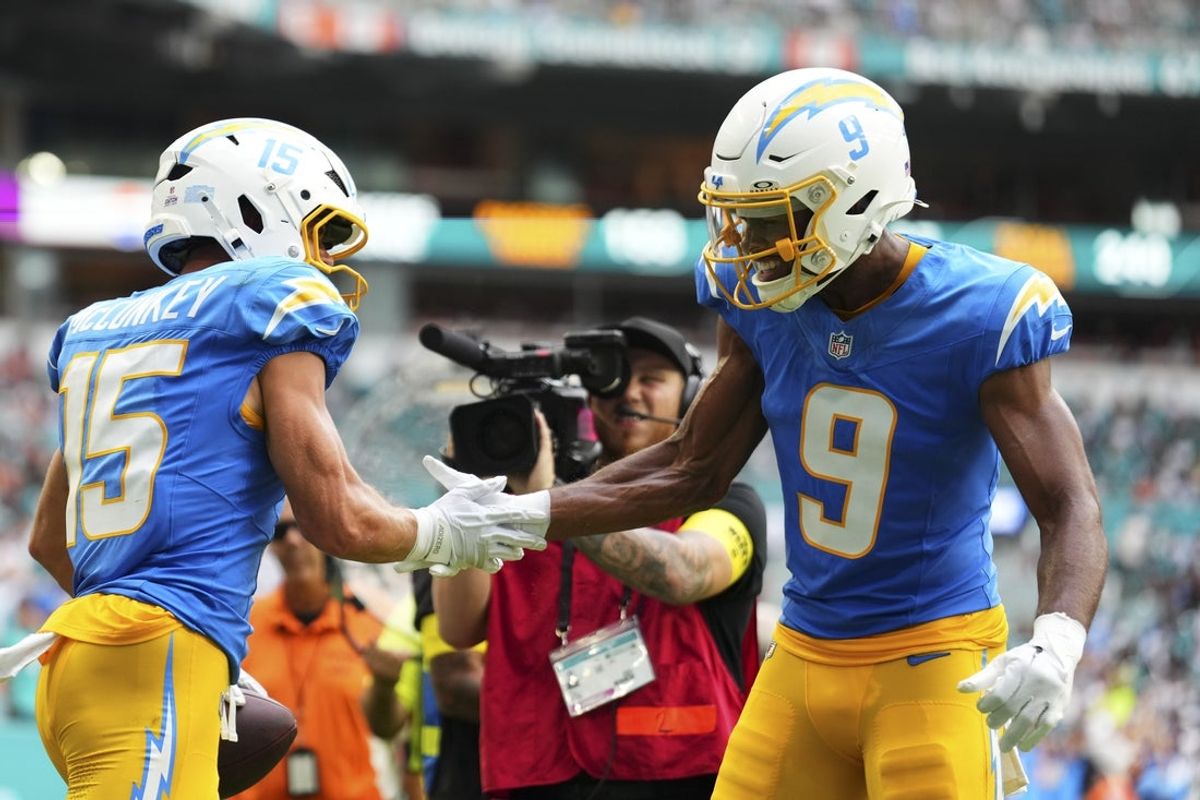 Oct 12, 2025; Miami Gardens, Florida, USA; Los Angeles Chargers wide receiver Ladd McConkey (15) celebrates after scoring a tocuhdown against the Miami Dolphins during the third quarter at Hard Rock Stadium. Mandatory Credit: Rich Storry-Imagn Images