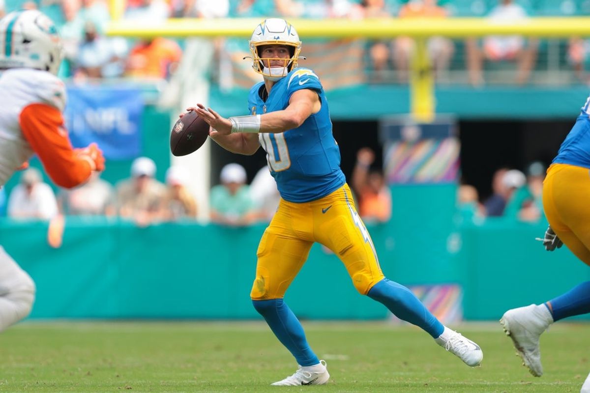 Oct 12, 2025; Miami Gardens, Florida, USA; Los Angeles Chargers quarterback Justin Herbert (10) passes the football against the Miami Dolphins during the third quarter at Hard Rock Stadium. Mandatory Credit: Sam Navarro-Imagn Images