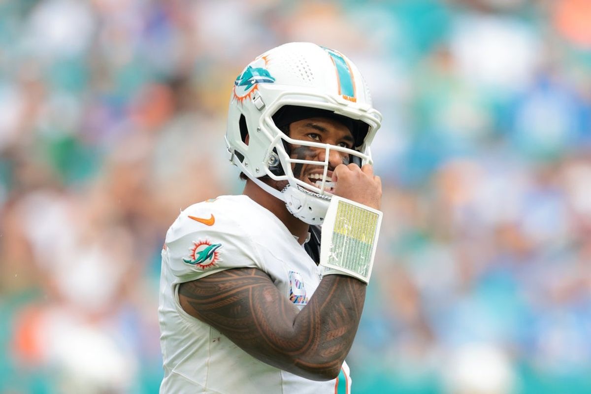 Oct 12, 2025; Miami Gardens, Florida, USA; Miami Dolphins quarterback Tua Tagovailoa (1) looks on from the field against the Los Angeles Chargers during the third quarter at Hard Rock Stadium. Mandatory Credit: Sam Navarro-Imagn Images