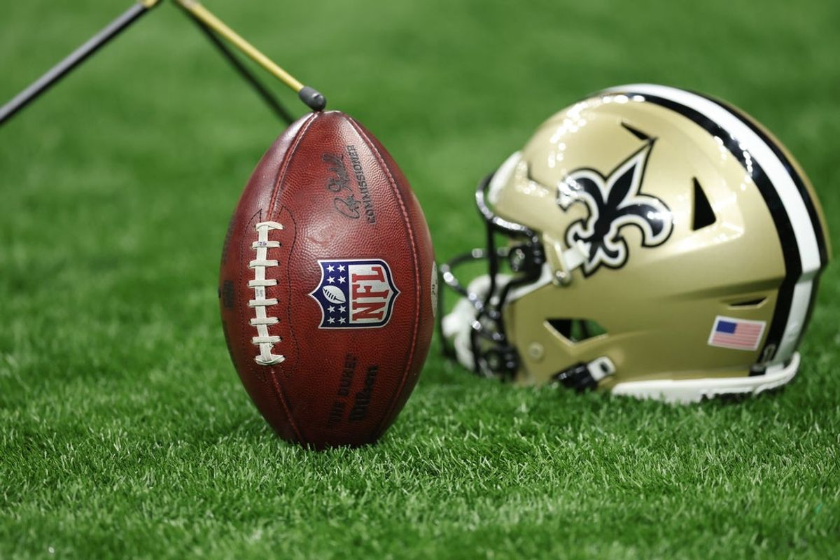 Oct 12, 2025; New Orleans, Louisiana, USA; The NFL logo is seen on a ball during the second half of a game between the New Orleans Saints and New England Patriots at Caesars Superdome. Mandatory Credit: Stephen Lew-Imagn Images