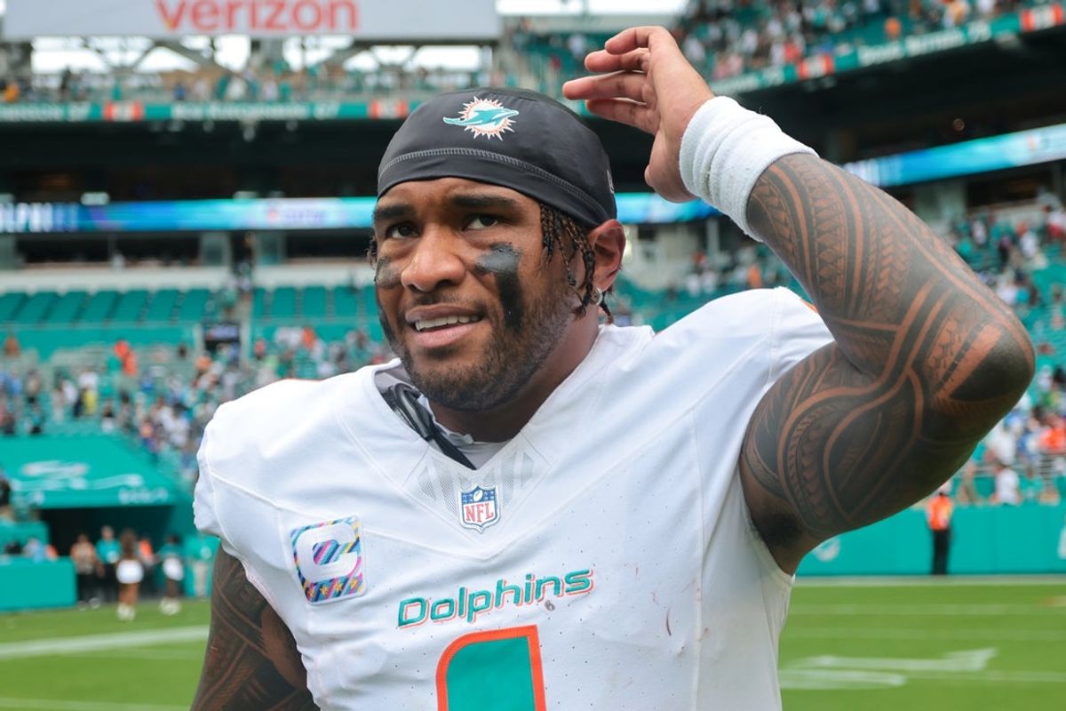 Oct 12, 2025; Miami Gardens, Florida, USA; Miami Dolphins quarterback Tua Tagovailoa (1) reacts after the game against the Los Angeles Chargers at Hard Rock Stadium. Mandatory Credit: Sam Navarro-Imagn Images