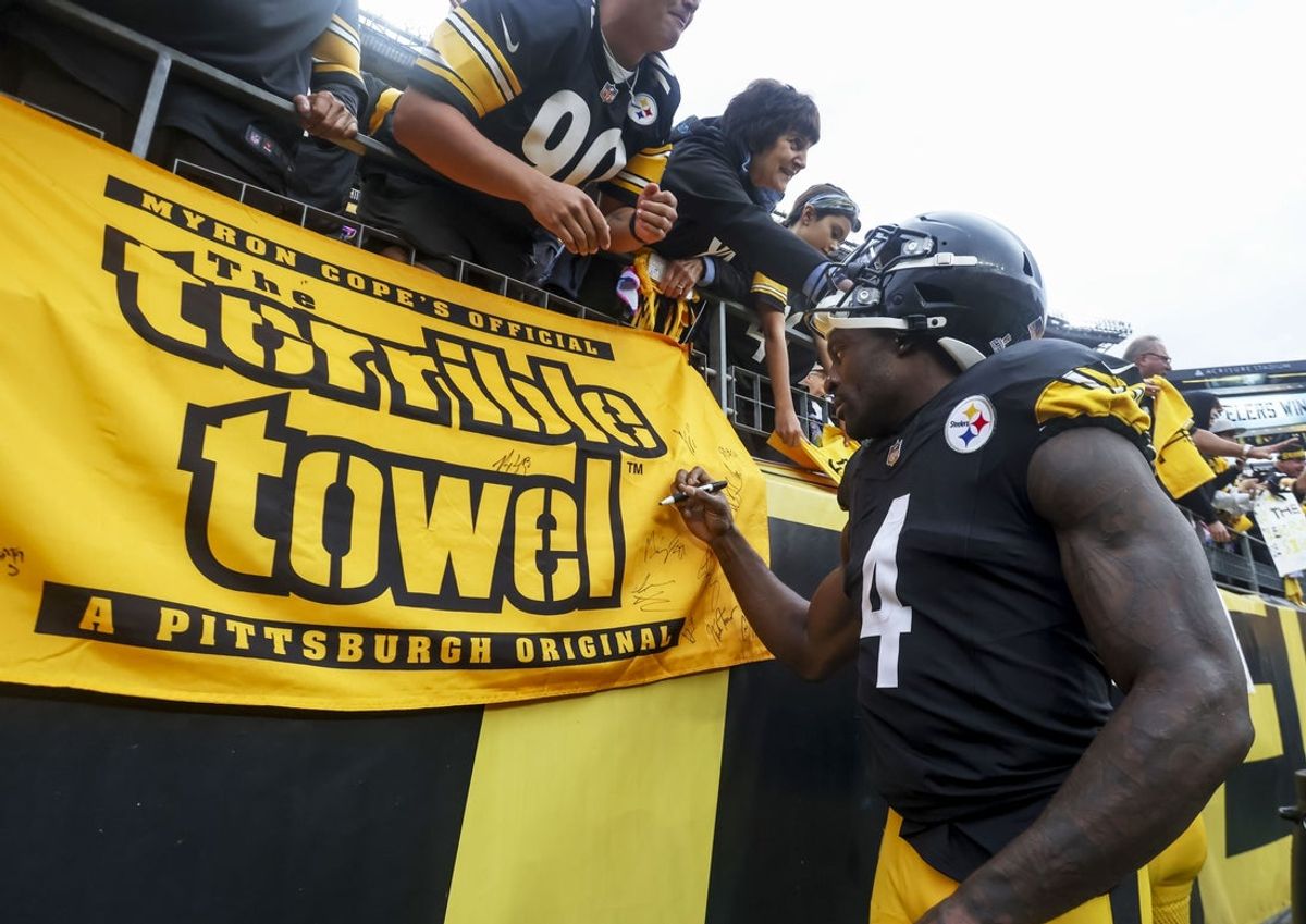 (File photo) Pittsburgh Steelers wide receiver DK Metcalf (4) signs a fan’s terrible towel after the game at Acrisure Stadium. Mandatory Credit: Charles LeClaire-Imagn Images