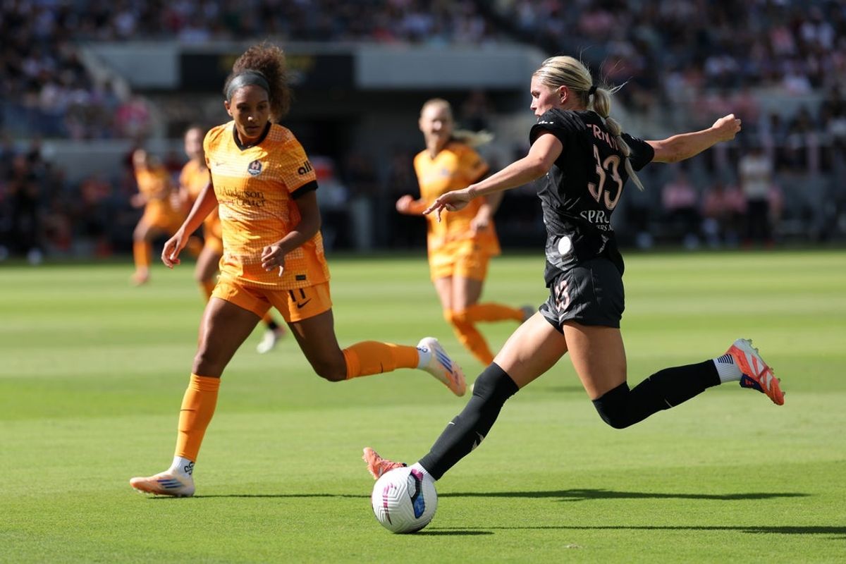 Oct 12, 2025; Los Angeles, California, USA;  Angel City FC forward Riley Tiernan (33) kicks the ball during the first half against the Houston Dash at BMO Stadium. Mandatory Credit: Kiyoshi Mio-Imagn Images