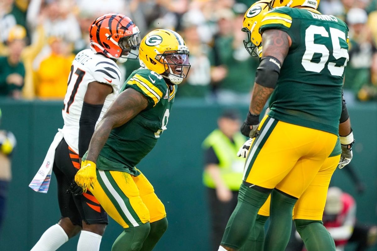 Oct 12, 2025; Green Bay, Wisconsin, USA; Green Bay Packers running back Josh Jacobs (8) celebrates a touchdown in the third quarter against the Cincinnati Bengals at Lambeau Field. Mandatory Credit: Jeff Hanisch-Imagn Images