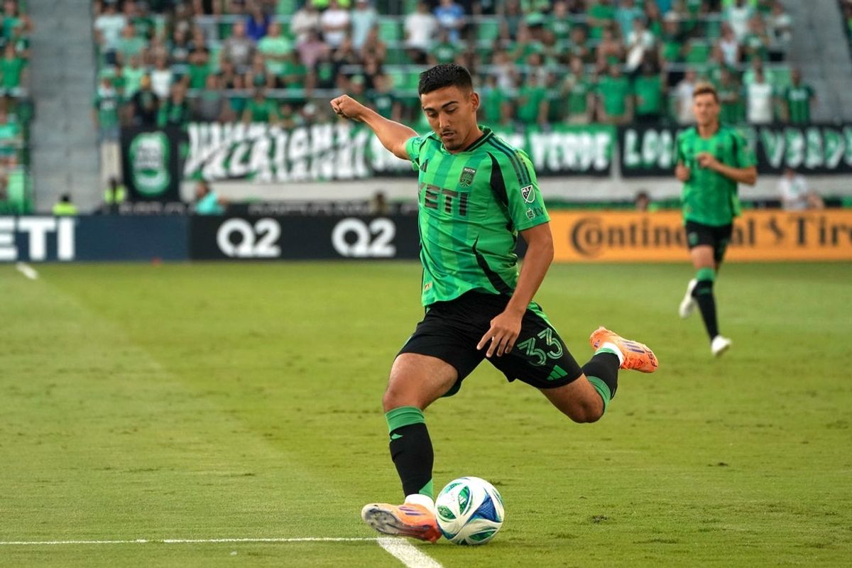 Oct 12, 2025; Austin, Texas, USA; Austin FC midfielder Owen Wolff (33) kicks to the goal during the first half against LAFC at Q2 Stadium. Mandatory Credit: Dustin Safranek-Imagn Images