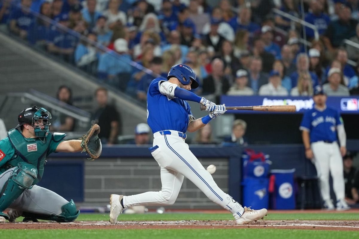 Oct 12, 2025; Toronto, Ontario, CAN; Toronto Blue Jays right fielder Nathan Lukes (38) hits a foul ball off his knee in the first inning during game one of the ALCS round for the 2025 MLB playoffs against the Seattle Mariners at Rogers Centre. Mandatory Credit: Nick Turchiaro-Imagn Images
