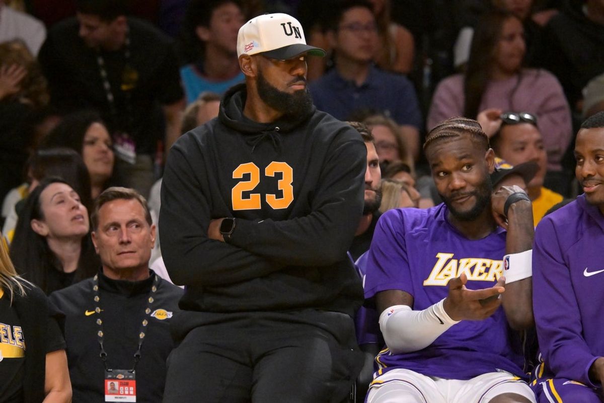 Oct 12, 2025; Los Angeles, California, USA;  Los Angeles Lakers forward Lebron James (23) looks on from the bench during the first half against the Golden State Warriors at Crypto.com Arena. Mandatory Credit: Jayne Kamin-Oncea-Imagn Images
