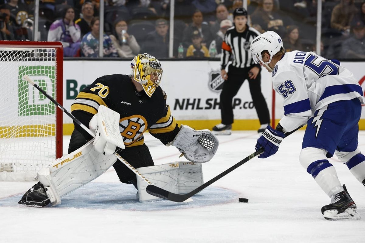 Oct 13, 2025; Boston, Massachusetts, USA; Tampa Bay Lightning center Jake Guentzel (59) looks for a rebound in front of Boston Bruins goaltender Joonas Korpisalo (70) during the first period at TD Garden. Mandatory Credit: Winslow Townson-Imagn Images