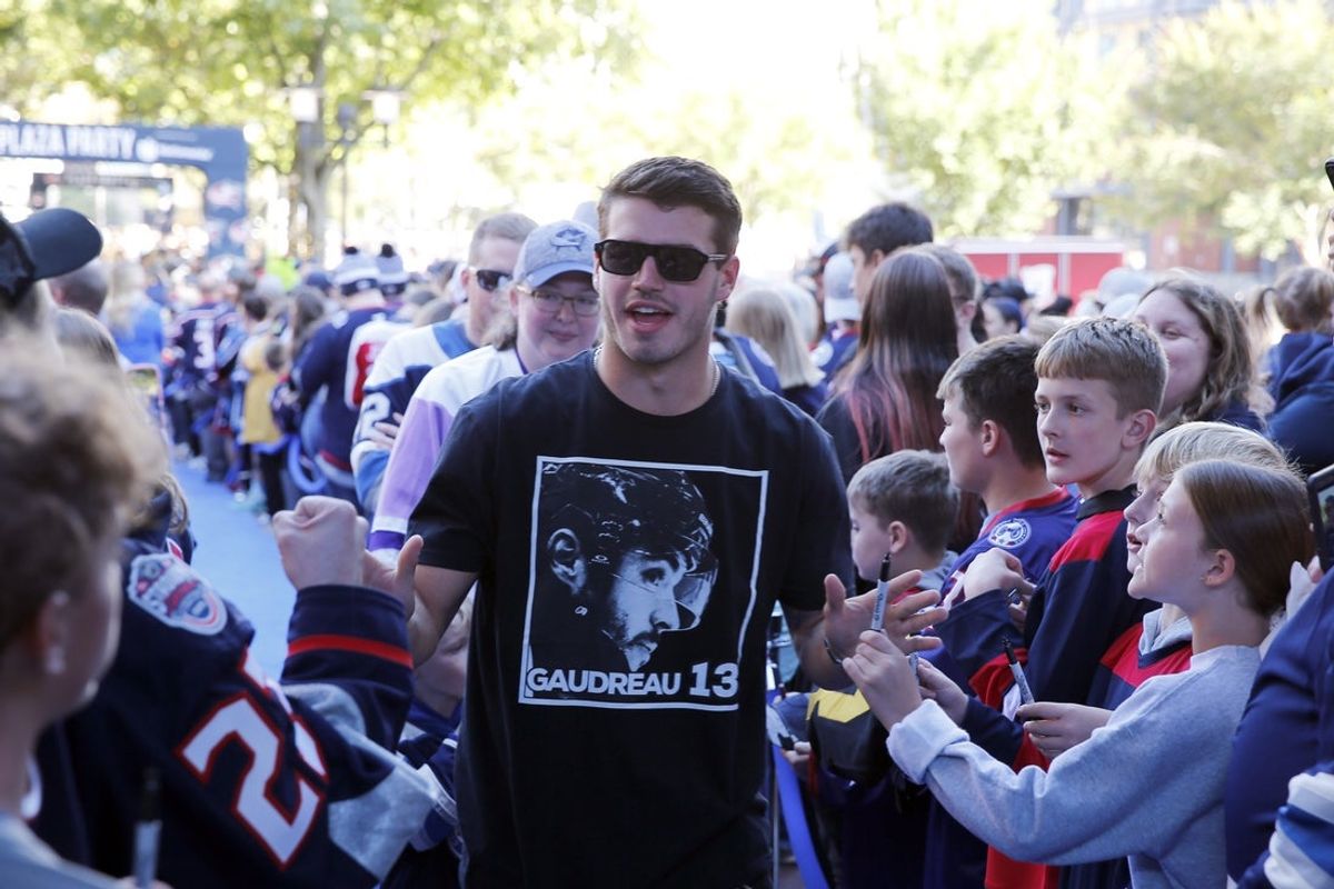Oct 13, 2025; Columbus, Ohio, USA; Columbus Blue Jackets center Cole Sillinger (4) walking the blue carpet greeting fans before the game on opening night against the New York Islanders at Nationwide Arena. Mandatory Credit: Russell LaBounty-Imagn Images