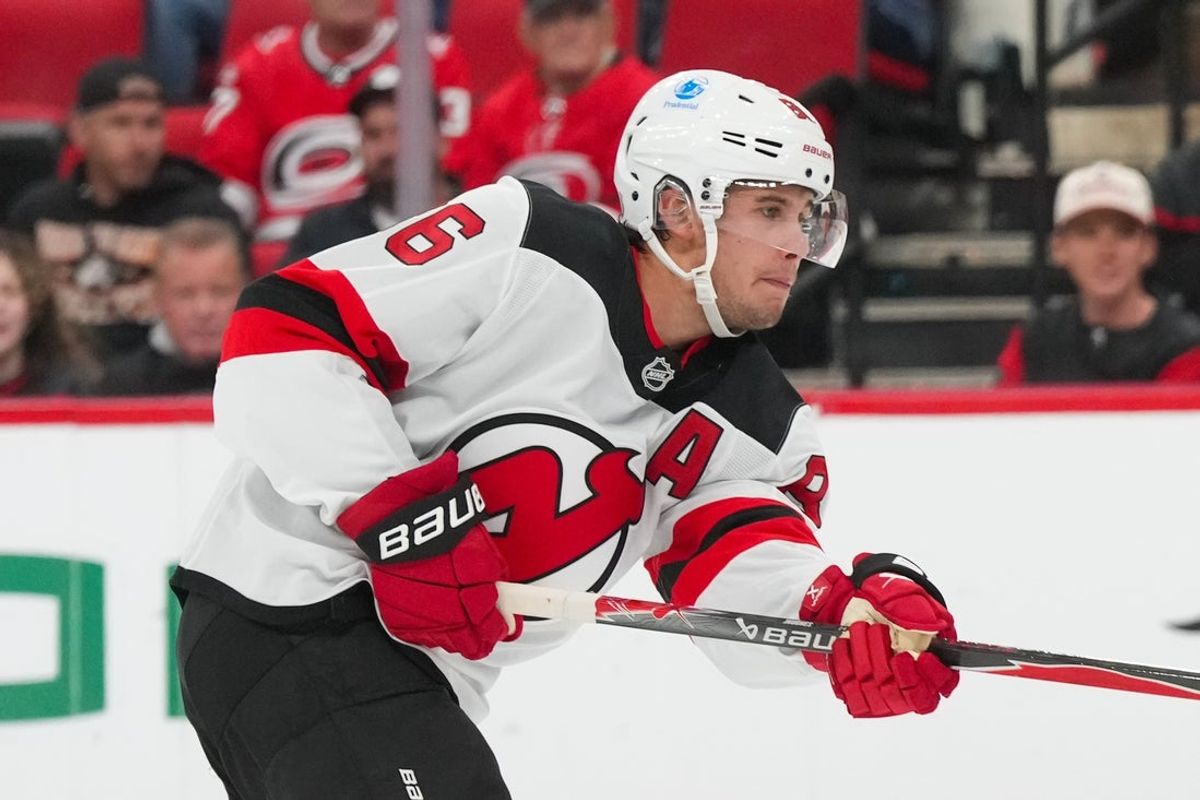 Oct 9, 2025; Raleigh, North Carolina, USA;  New Jersey Devils center Jack Hughes (86) takes a shot against the Carolina Hurricanes during the second period at Lenovo Center. Mandatory Credit: James Guillory-Imagn Images