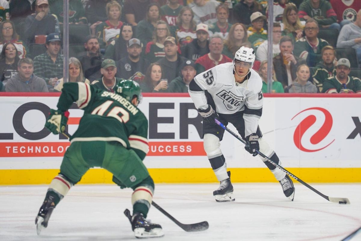 Oct 13, 2025; Saint Paul, Minnesota, USA; Los Angeles Kings right wing Quinton Byfield (55) shoots as Minnesota Wild defenseman Jared Spurgeon (46) defends in the first period at Grand Casino Arena. Mandatory Credit: Matt Blewett-Imagn Images