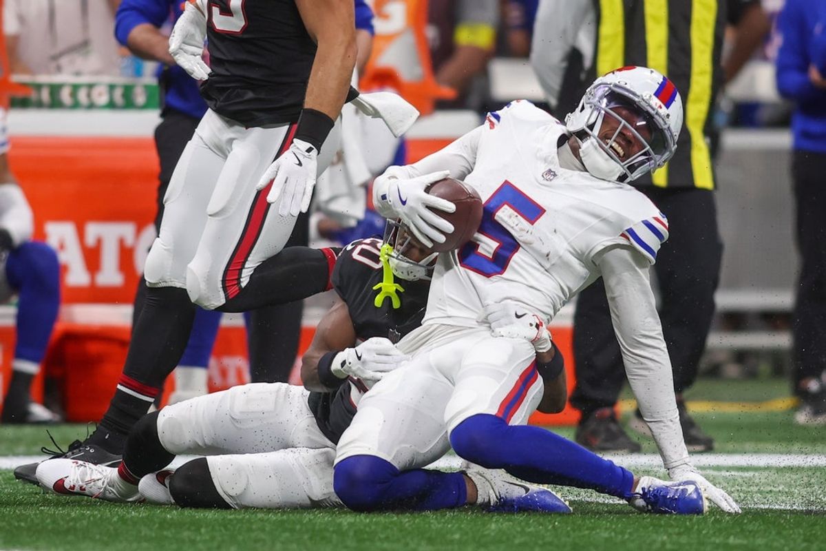 Oct 13, 2025; Atlanta, Georgia, USA; Buffalo Bills wide receiver Josh Palmer (5) is tackled by. Atlanta Falcons cornerback Dee Alford (20) during the first half of a game at Mercedes-Benz Stadium. Mandatory Credit: Brett Davis-Imagn Images
